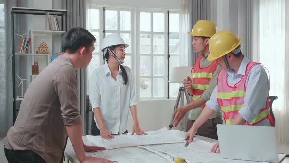 Engineers With Helmets Sharing Ideas About Work To A Man, Angry Colleagues Debate Fight