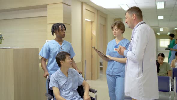 Young two male and female doctor talk to the patient and view the information in the patient file