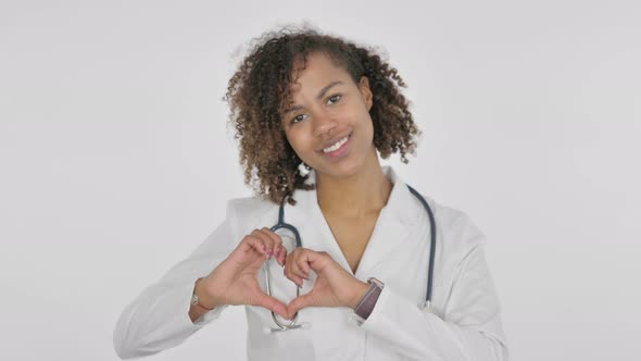 Heart Gesture By African Female Doctor on White Background