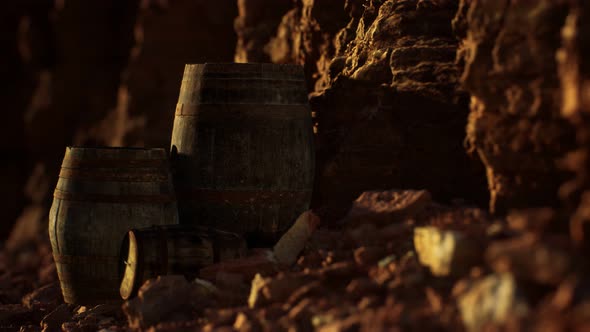 Old Wooden Vintage Wine Barrels Near Stone Wall in Canyon