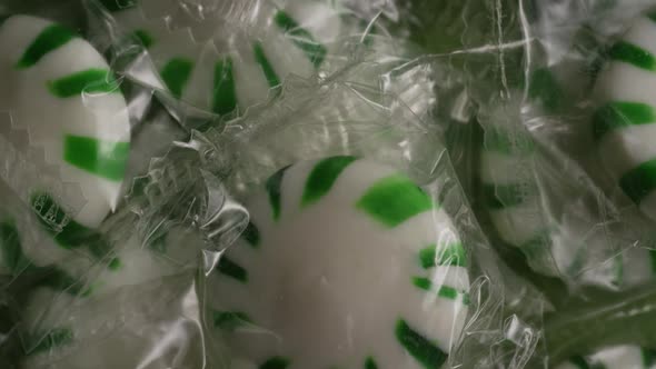 Rotating shot of spearmint hard candies - CANDY SPEARMINT 007