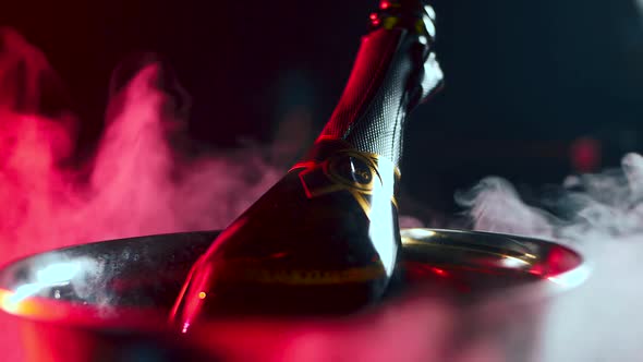 A Bottle of Expensive Champagne is Cooled in an Ice Bucket
