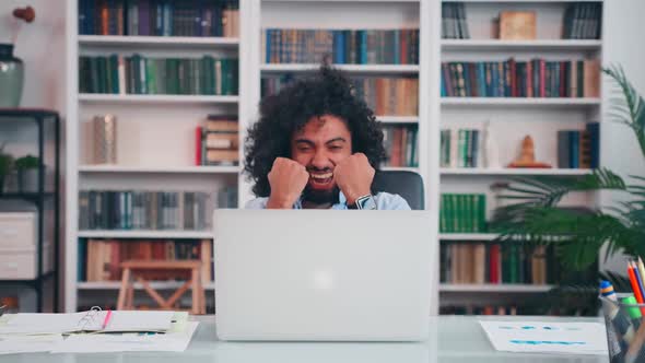 Overjoyed Emotional Arabian Man Starts to Shout and Rejoice Looking at Laptop