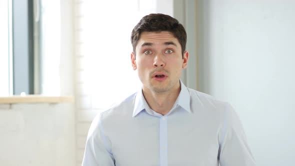 Amazed By Surprise Man in Office Indoor