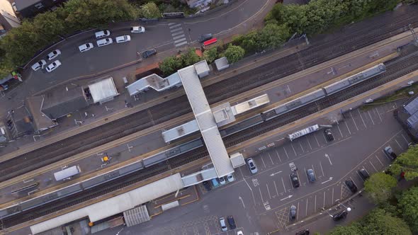 Trains Stopping at a Station in the UK Aerial View