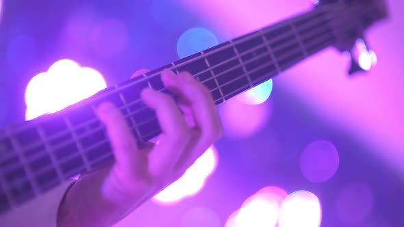 Guitarist Playing Electric Guitar at Concert