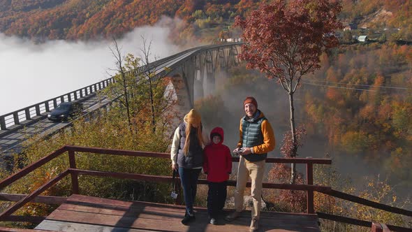 Family of Tourists Visits the Magnificent Djurdjevica Bridge Over the Tara River Canyon in the