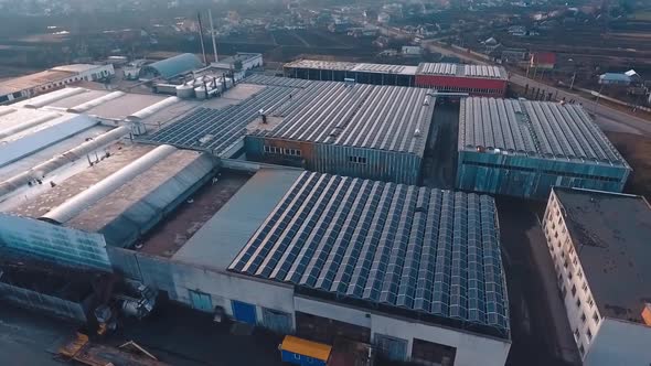 Solar panels on factory roof. Aerial view of solar panels mounted on flat roof