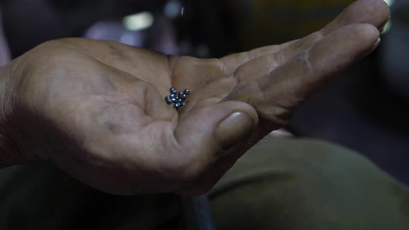 Bullets Gun On The Elderly's Hand