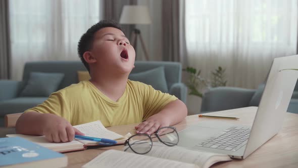 Tried Asian Little Boy During Home Work In Living Room