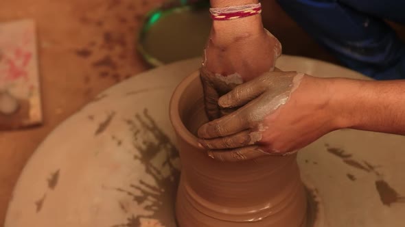 Potter at Work Makes Ceramic Dishes