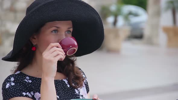 Beautiful Young Lady Enjoying Cup of Espresso at Street Cafe, Luxury Resort