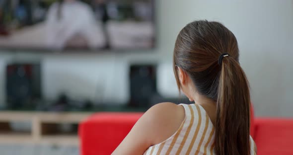 Woman watch tv at home