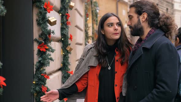 Attractive Romantic Young Lovers Shopping in The City at Christmas Time