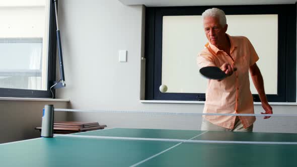 Senior man playing table tennis