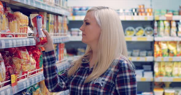 Attractive Woman Buying Food in a Supermarket