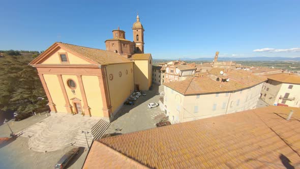 Drone Shot Of Collegiata Di San Martino, A Roman Catholic Collegiate Church In Sinalunga, Italy - ae