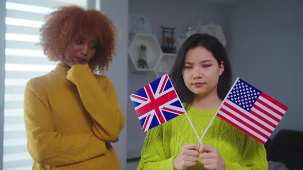 Student Exchange Program. Asian Woman Deciding Between United States and United Kingdom. African