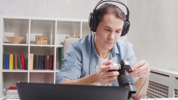 Workplace of freelance worker at home office. Young man works using computer.