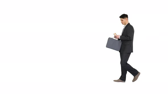 Young Business Man Walking Counting Euro Bills on White Background.