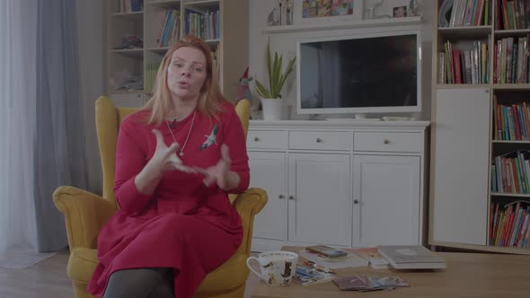 Woman Speaks Actively Gesturing in Home Interiors