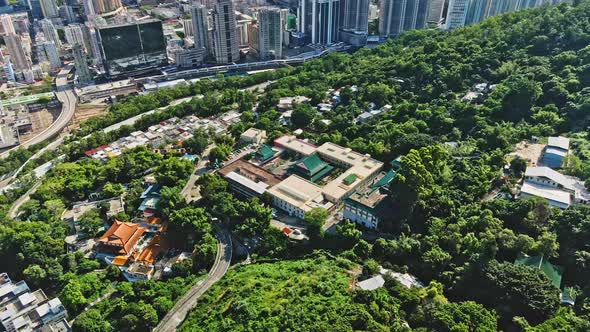 Aerial drone shot of old temple in Tsuen Wan, Hong Kong cityscape