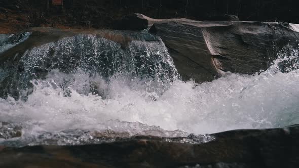 Wild Mountain River Flowing with Stone Boulders and Stone Rapids. Slow Motion