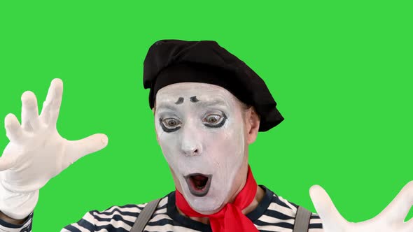 Mime Character with Imaginary Ball on a Green Screen Chroma Key