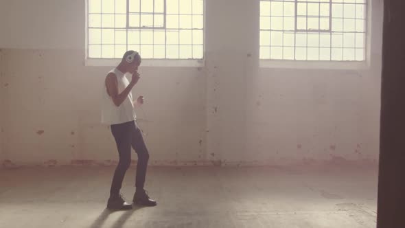 Fashionable young man in an abandoned warehouse