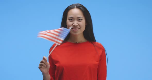 Young Woman Waving with Us Flag