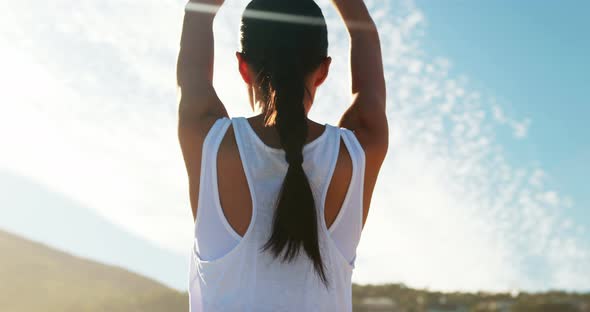 Rear view of woman performing yoga