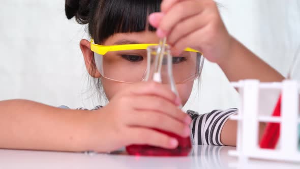 Children are learning and doing science experiments in the classroom.