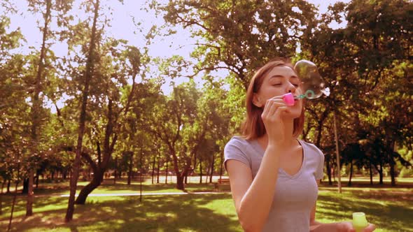 Joyful Lady Plays in Park