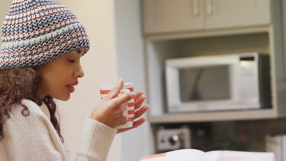 Woman in warm clothing having coffee 4K 4k