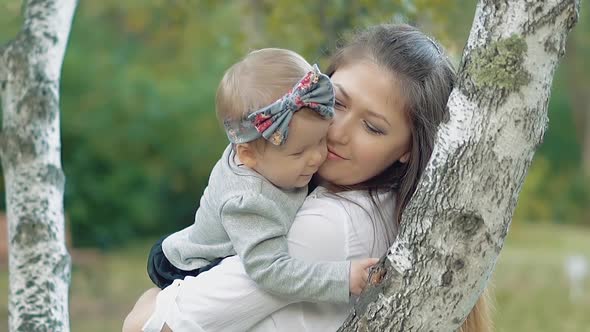 Young Beautiful Mother with a Little Baby