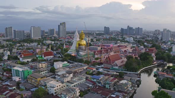 Aerial view of the Giant Golden Buddha in Wat Paknam Phasi Charoen Temple