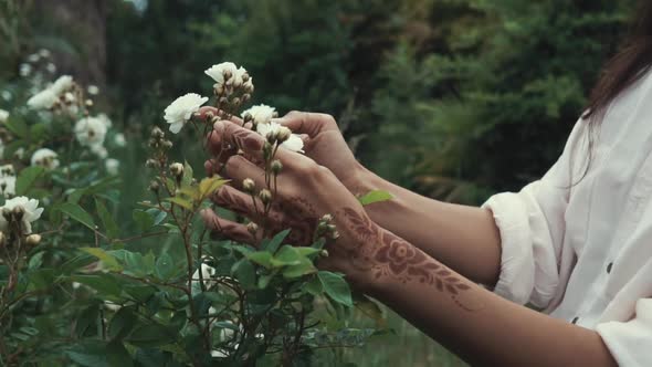 Woman Enjoying Nature in Garden.