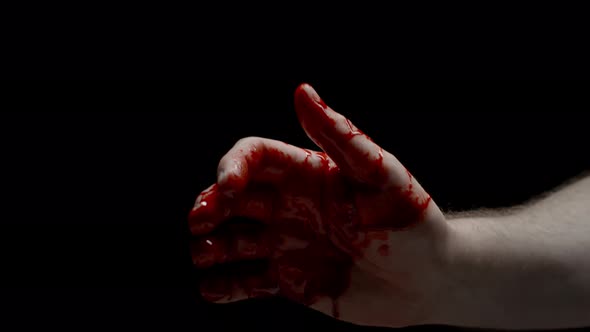 Closeup Caucasian Male Hand Covered in Blood Showing Thumb Up Sign Crime Scene Bloody Hand Isolated