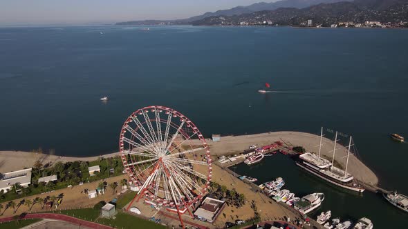 Drone View of a Beautiful Ferris Wheel on the Beach of Batumi Georgia