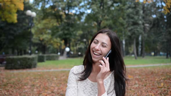 Cheerful Girl Portrait Talking on the Phone and Laughing