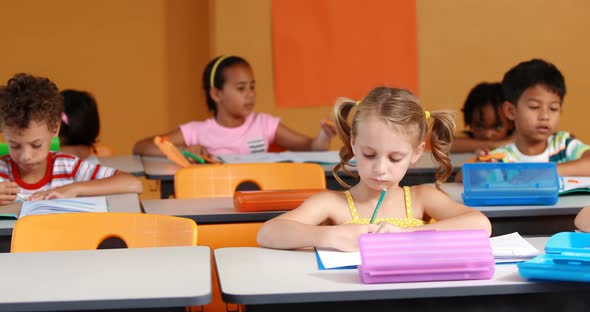 School kids studying in classroom