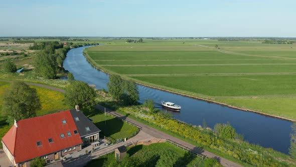 Fly Over Luxury Ship Sailing On The River In Ossenzijl, Friesland, Netherlands. Aerial Drone Shot