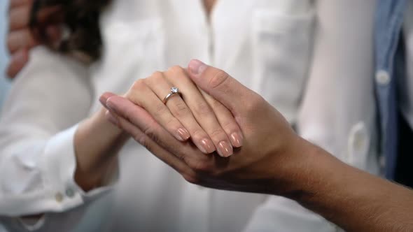 Man Tenderly Holding Fiancee Hand With Engagement Ring, Future Family, Love