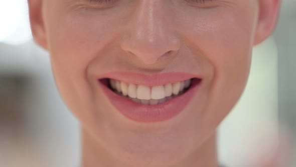 Close Up of Smiling Mouth of Young Woman 