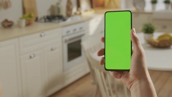 Point of View of Man at Phone with Green Screen for Copy Space