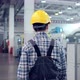 Shot of Professional Factory Worker Wearing Hard Hat Holds Tablet Computer Walking Through Modern - VideoHive Item for Sale