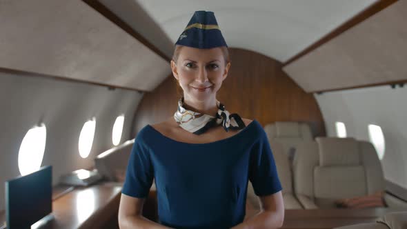 Portrait of Young Stewardess Inside of Private Jet Cabin.