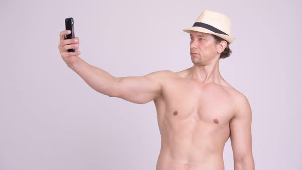 Handsome Muscular Tourist Man Taking Selfie Shirtless
