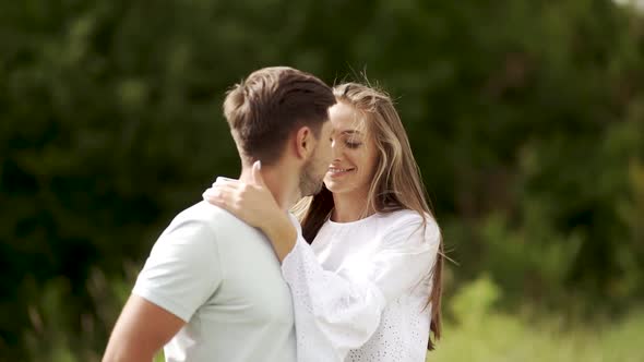 Love Kiss. Beautiful Couple Kissing In Nature. Happy Woman Meeting Handsome Man.