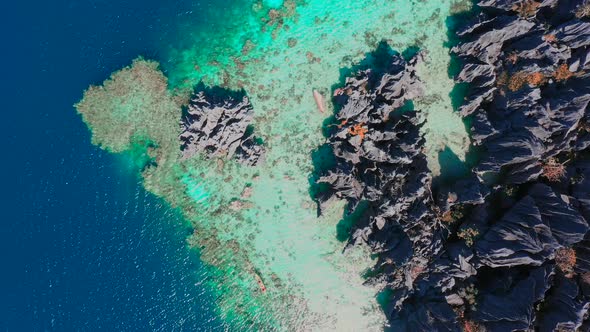 Flying amazing rocks and tropical coral reef lagoon